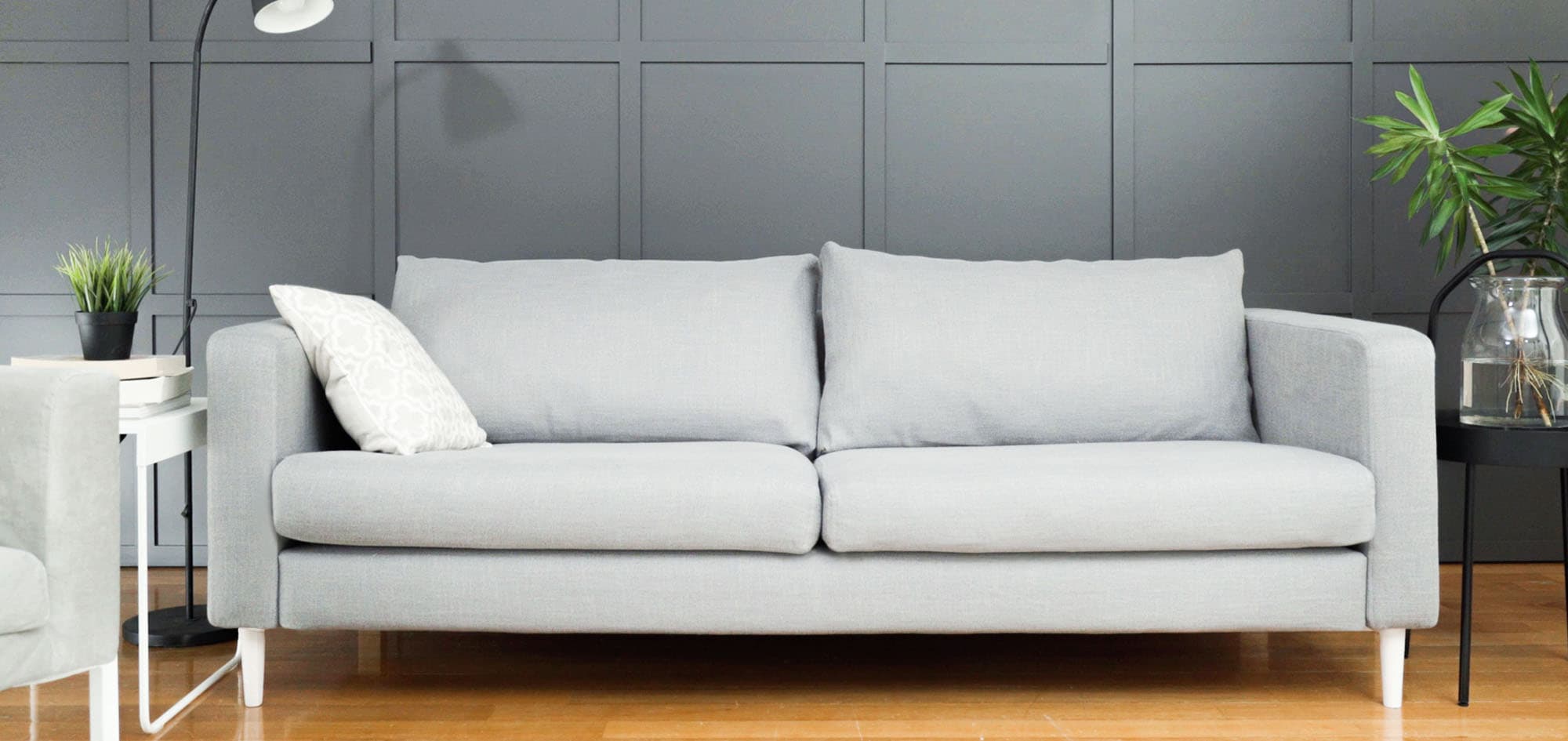 Grey Karlstad sofa cover with white legs