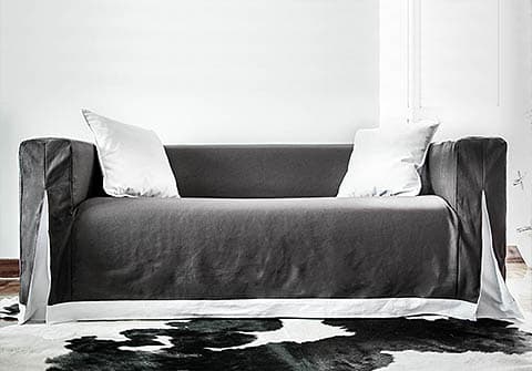 Long skirted Klippan sofa cover with unique pleats and contrast skirting by Comfort Works